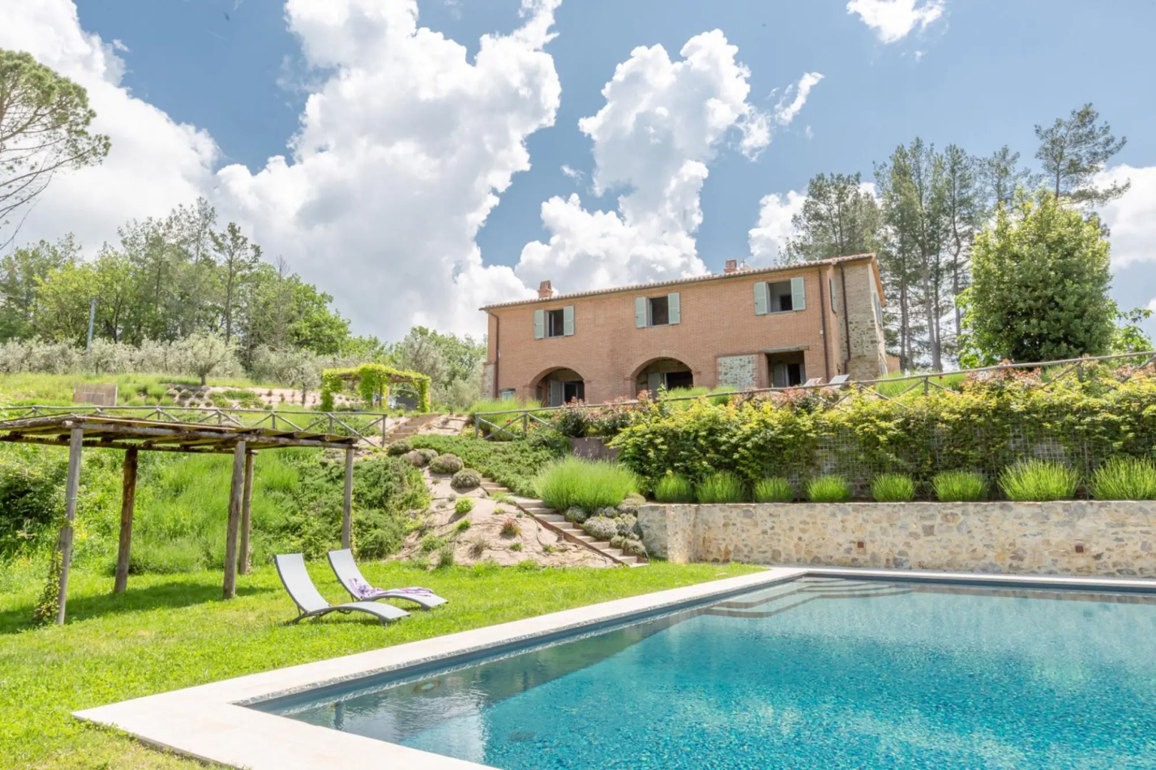 In an enchanting position, located on a hill, Podere Calcina is a recently completely renovated farm-Podere Calcina