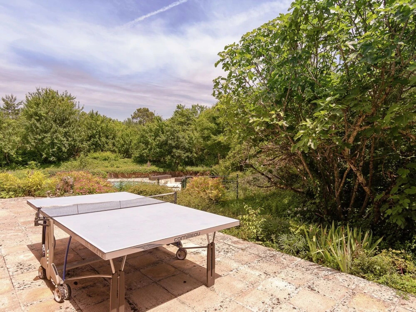 A Romantic Hamlet With Lush Gardens on a Hill