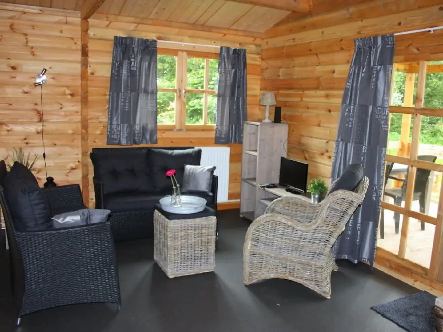 Wooden Cottage With a Veranda Located in a Natural Area