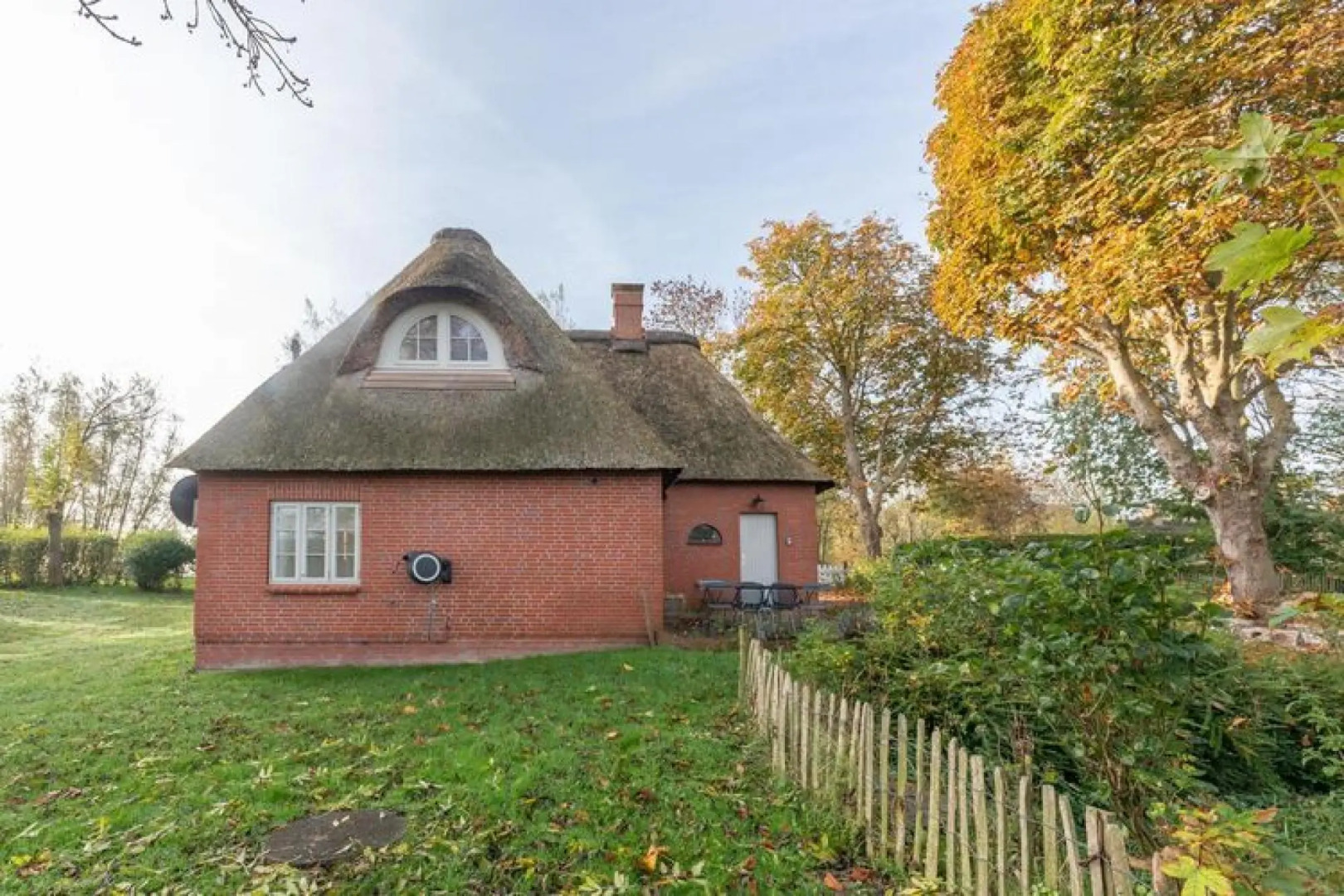 thatched cottage with tiled stove