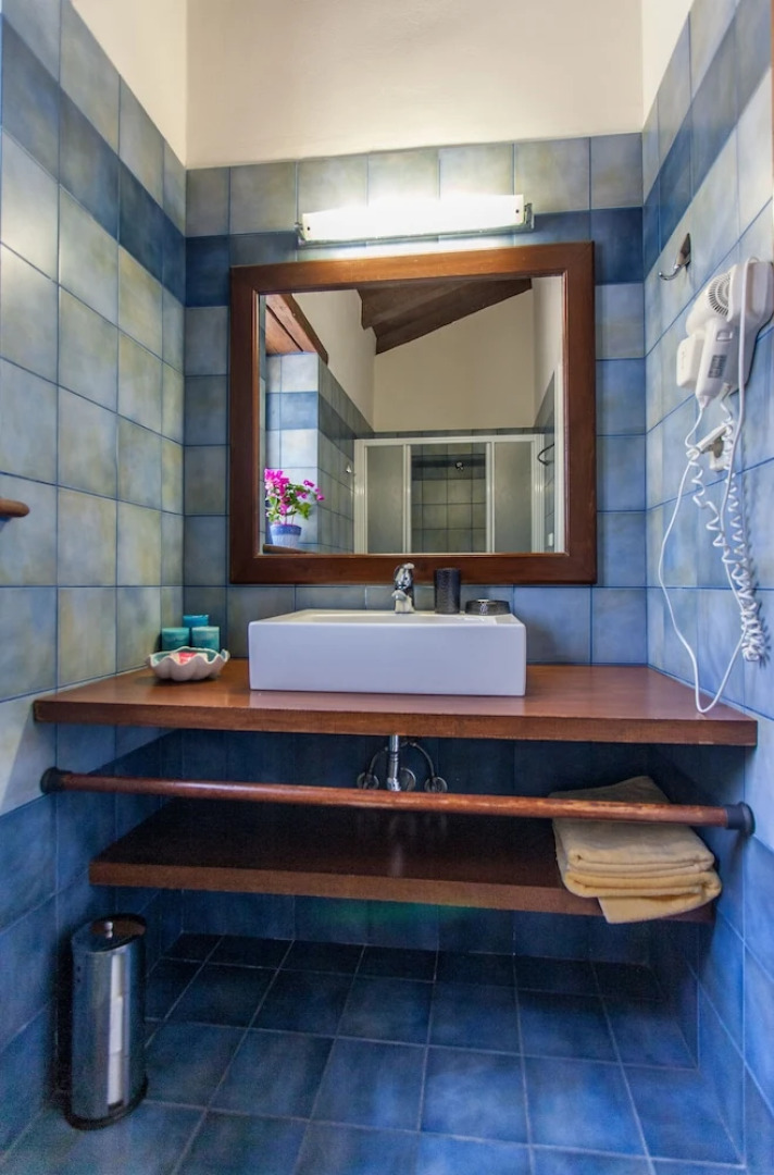 Dine on the Generous Veranda at a Rustic Stone Getaway