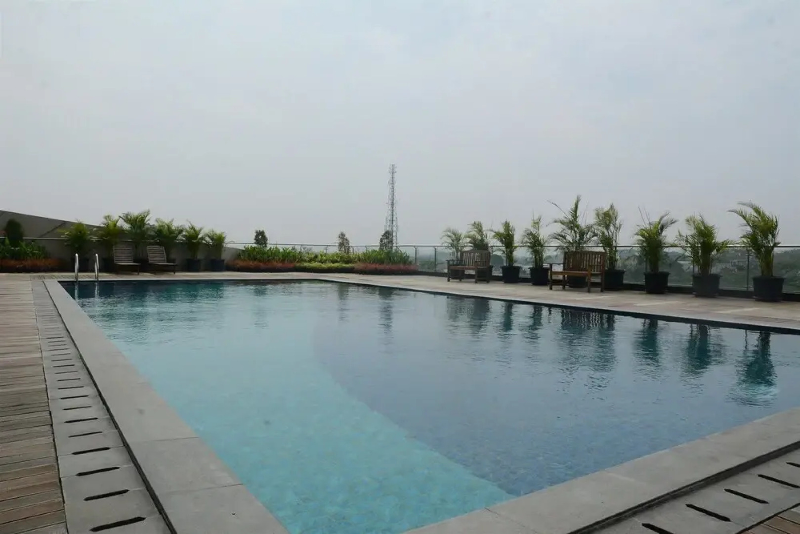 Homey Studio Room Tree Park Apartment near BSD City By Travelio