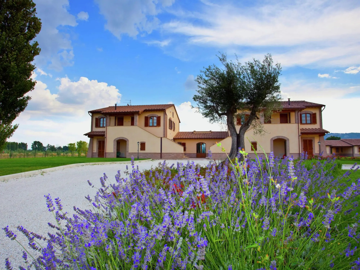 An agritourism complex with views of Assisi.