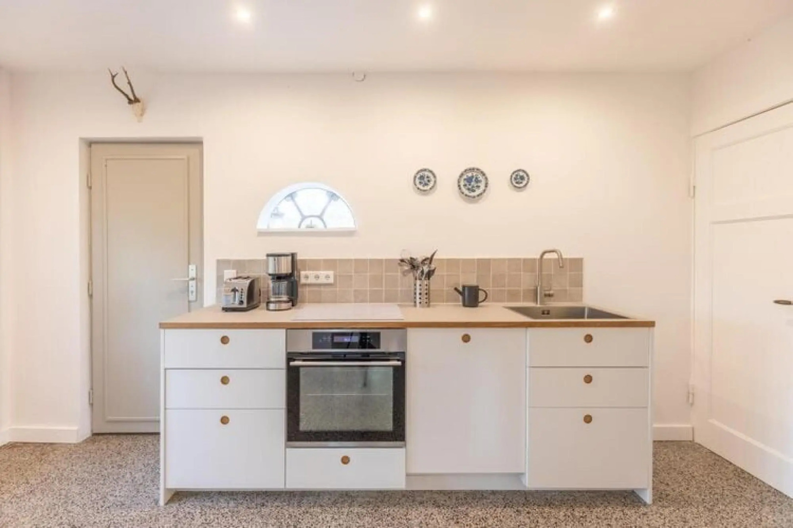 thatched cottage with tiled stove