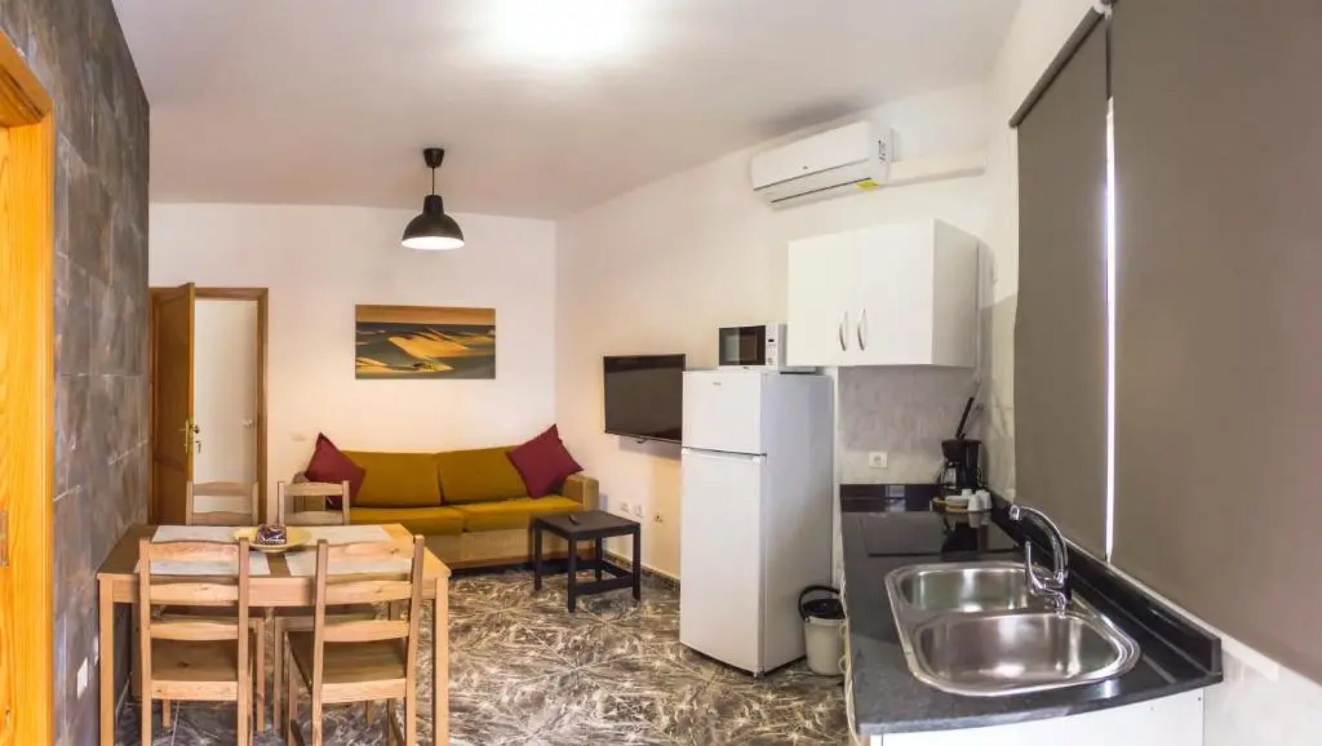 Apartamentos La Aldea Suites