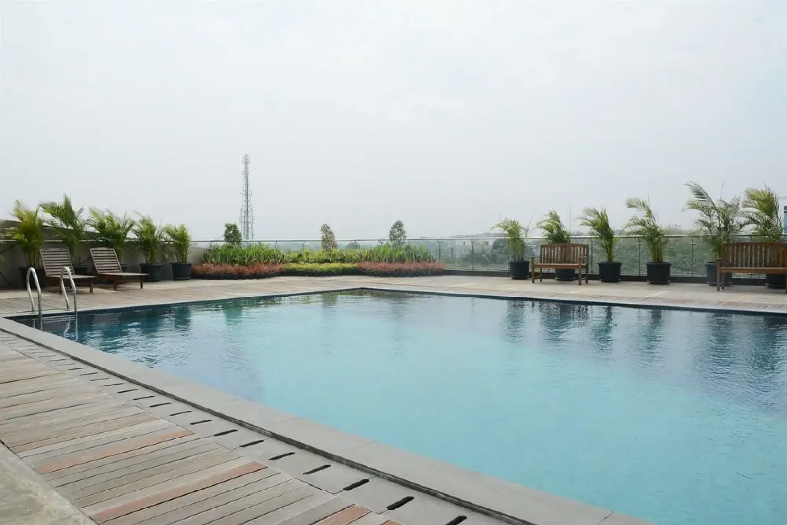 Homey Studio Room Tree Park Apartment near BSD City By Travelio