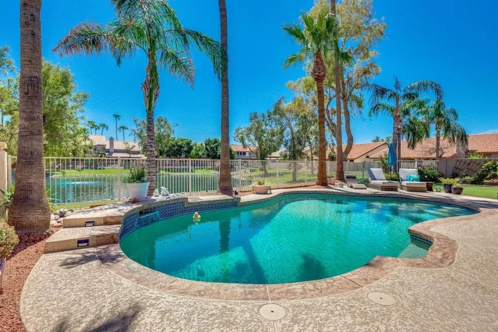 Updated Waterfront Home W/ Private Heated Pool & Garage. Near Arrowhead Shops! By Redawning