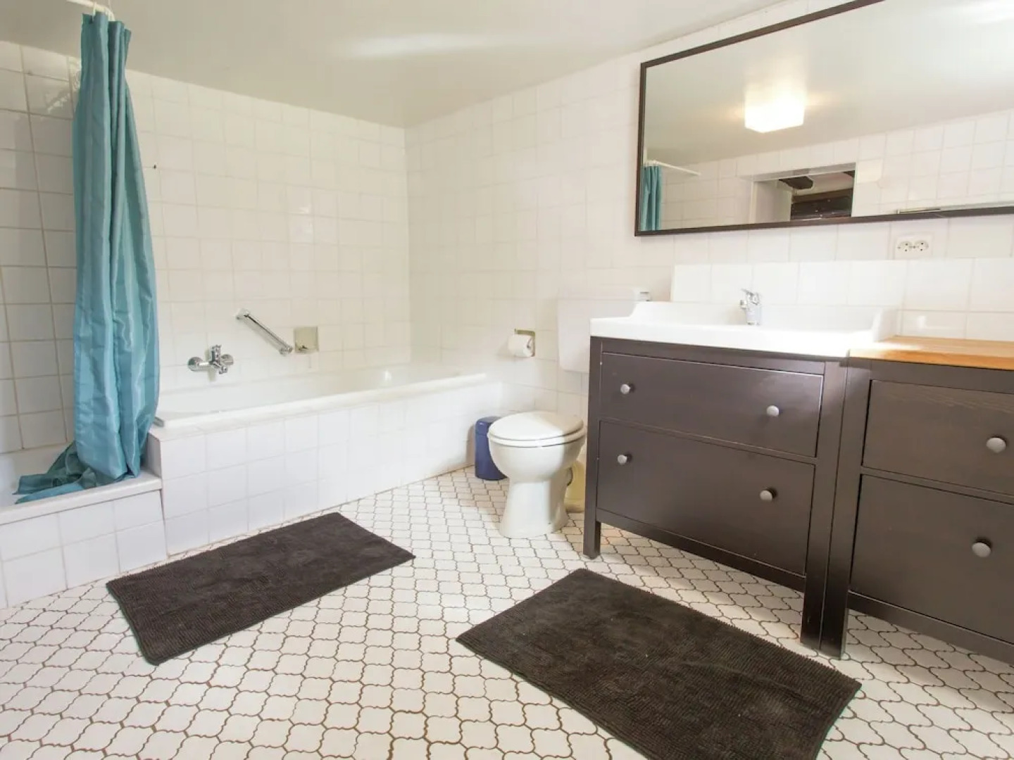 A Lovely Watermill Surrounded by Delightful Greenery