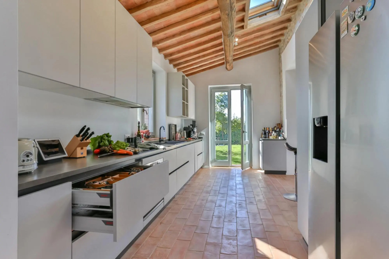 In an enchanting position, located on a hill, Podere Calcina is a recently completely renovated farm-Podere Calcina