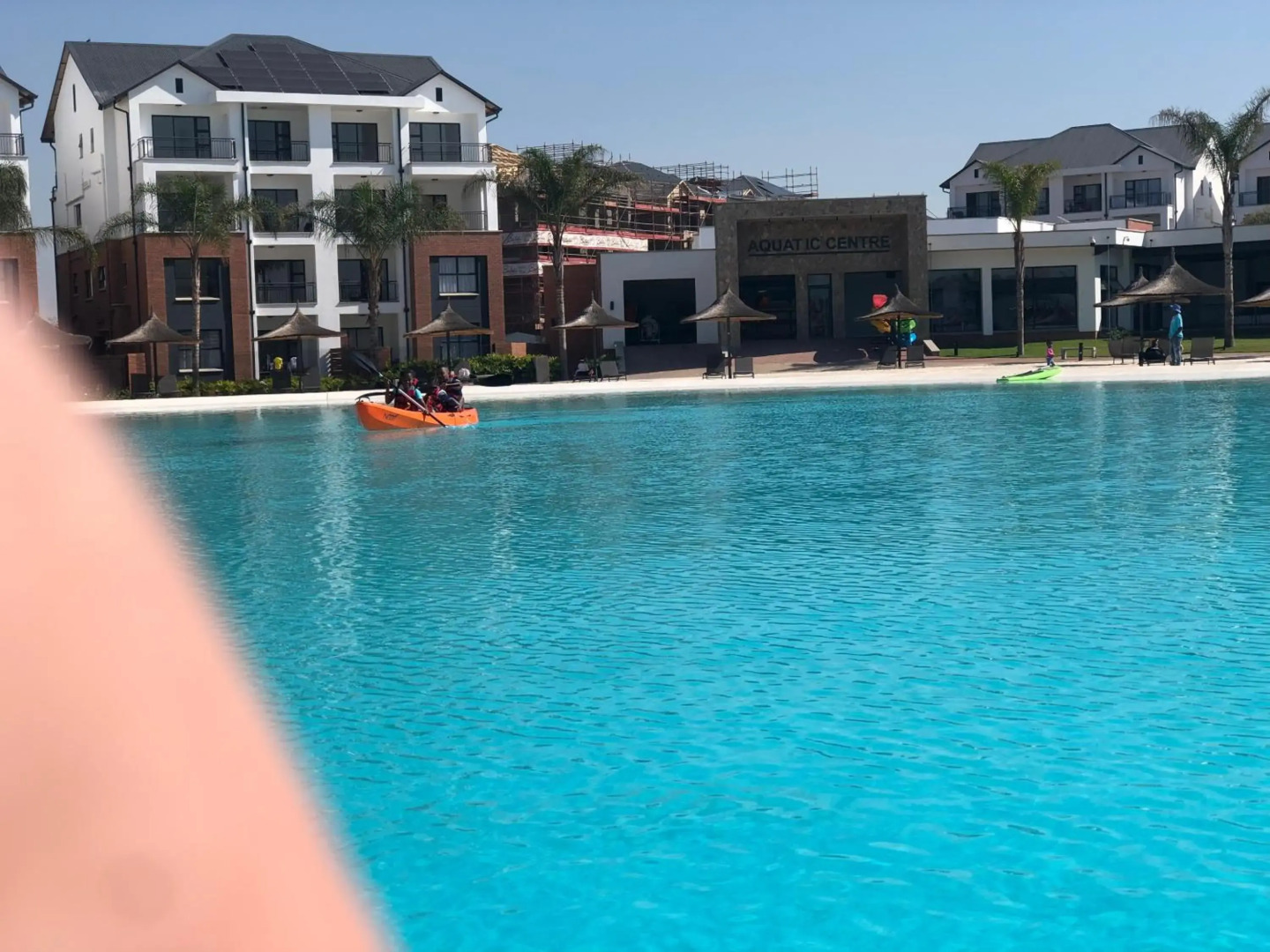 A Coastal/island experience at a Large 2 bed apartment at a Crystal Lagoon Estate.