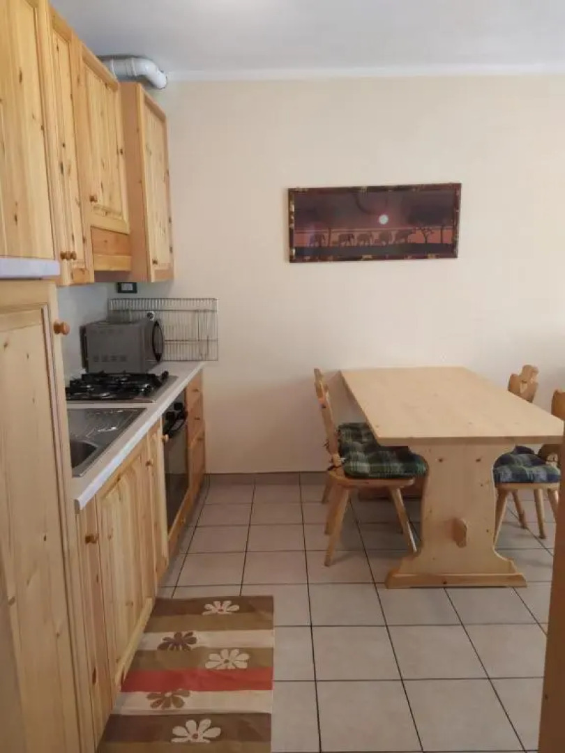 bilocale con giardino e box