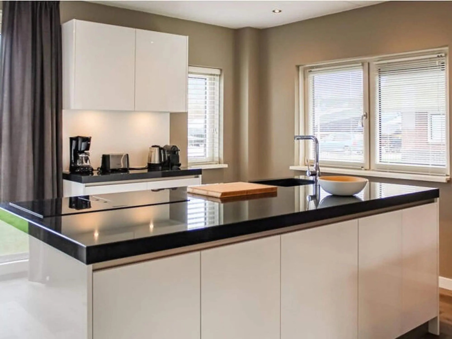 Villa with enclosed garden, in a holiday park on the water in Friesland