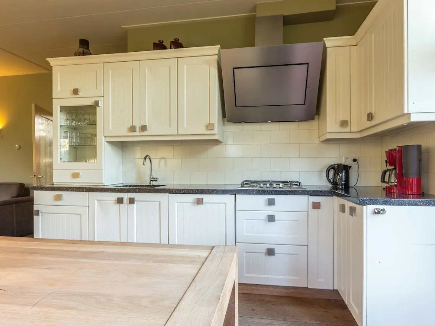 Characteristic house with a garden, surrounded by forest