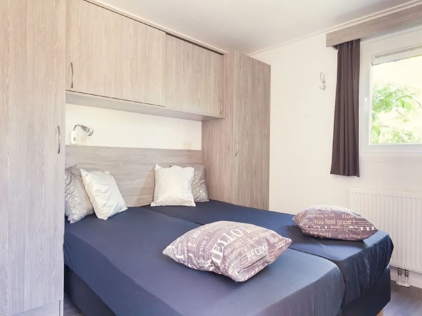 Comfy chalet with a dishwasher, directly on a pond