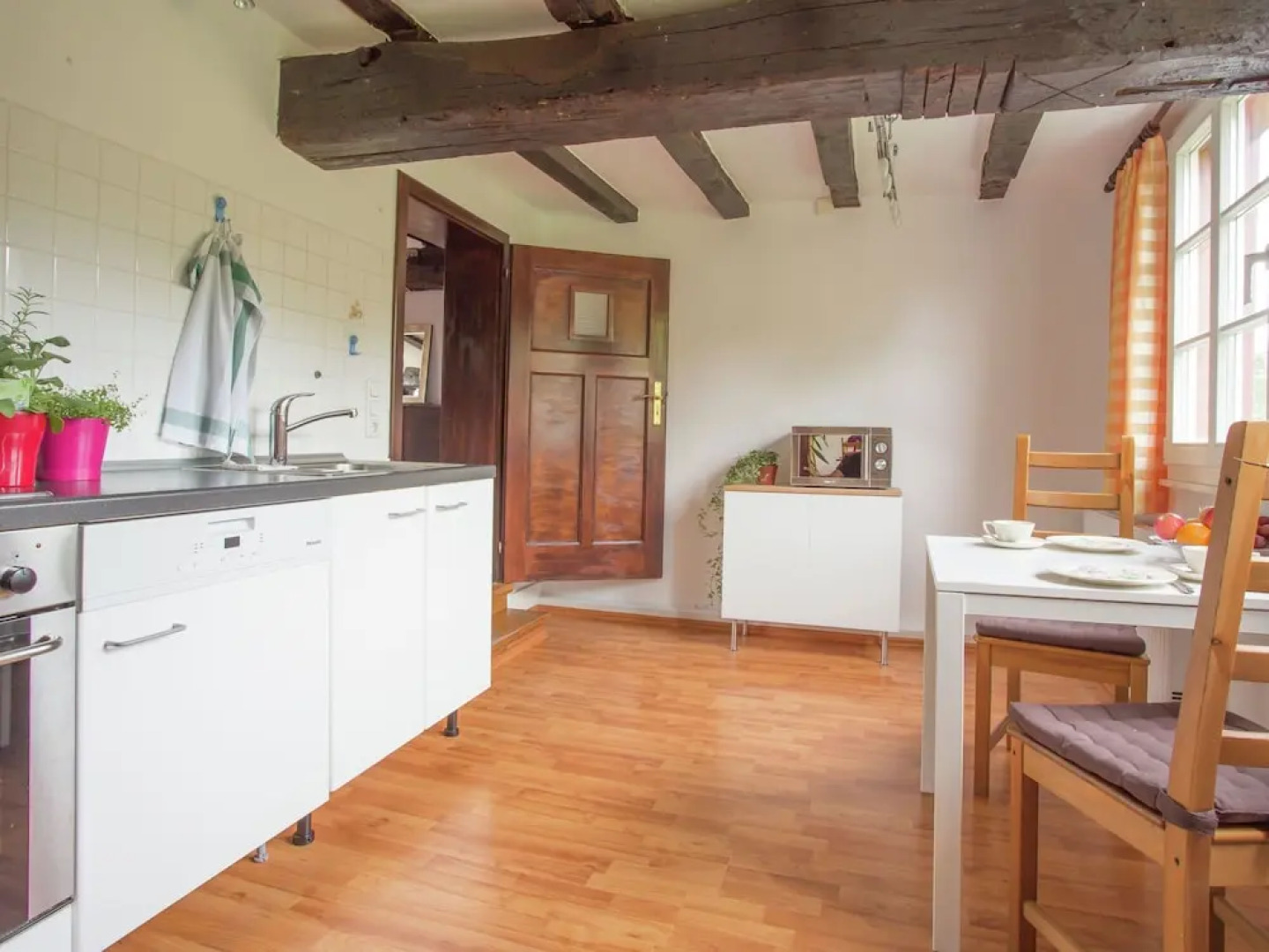 A Lovely Watermill Surrounded by Delightful Greenery