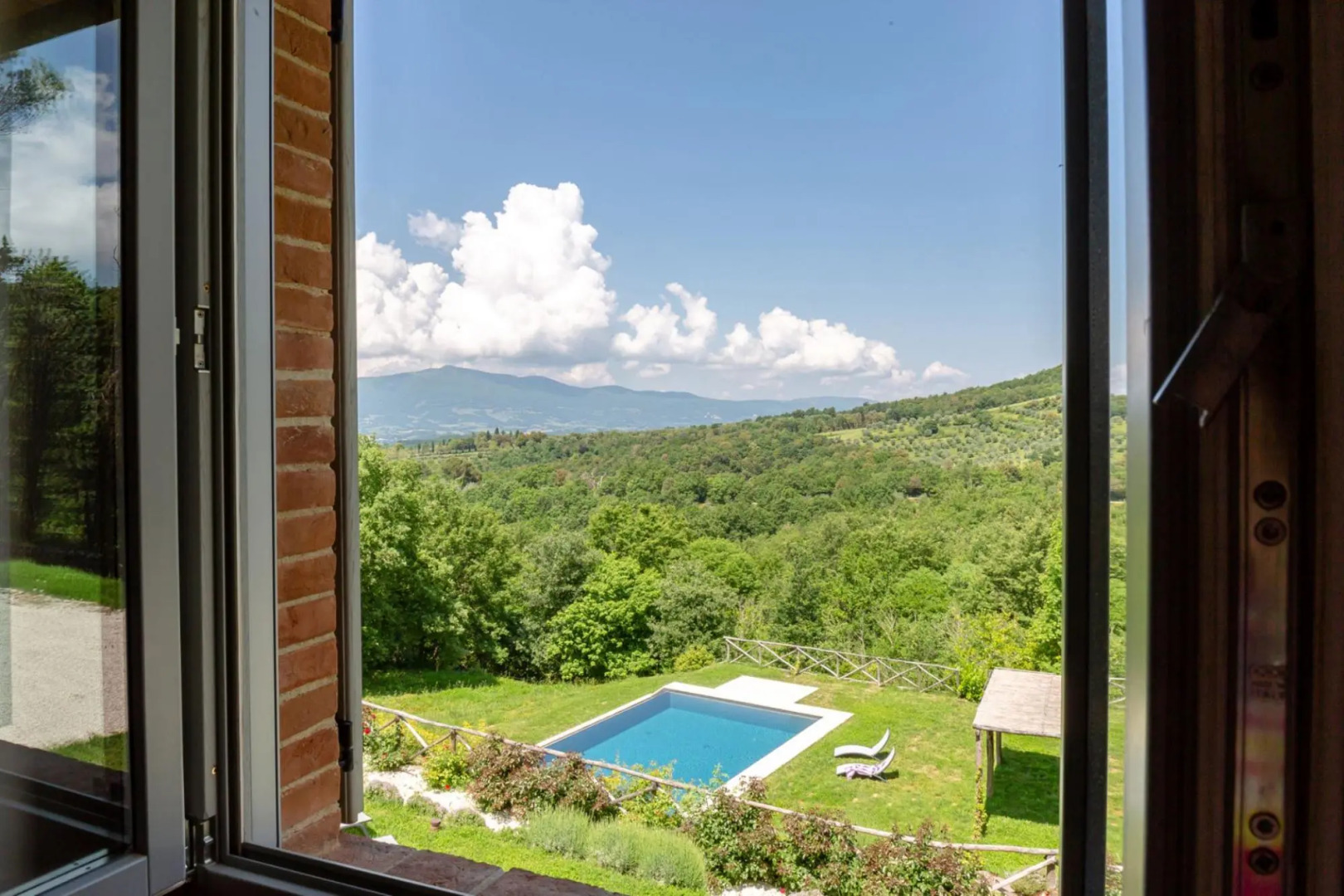 In an enchanting position, located on a hill, Podere Calcina is a recently completely renovated farm-Podere Calcina