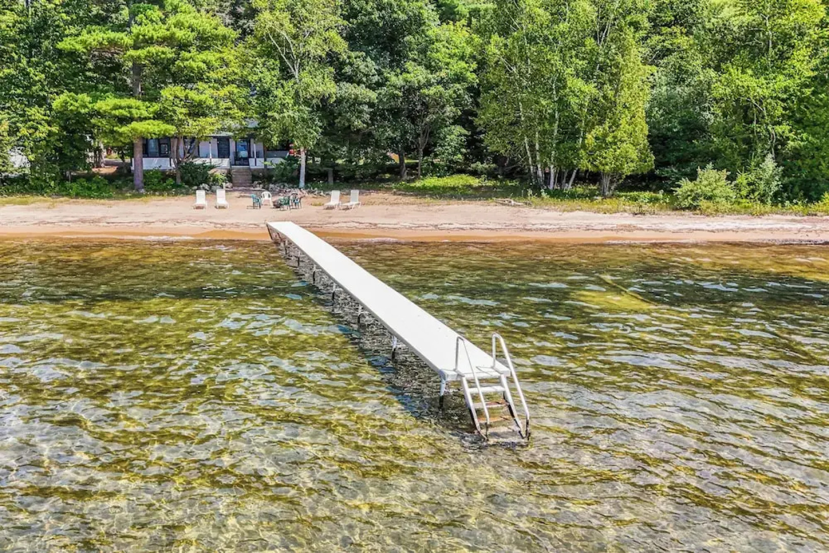 Torch Lake Getaway w/ Private Beach + Boat Dock!