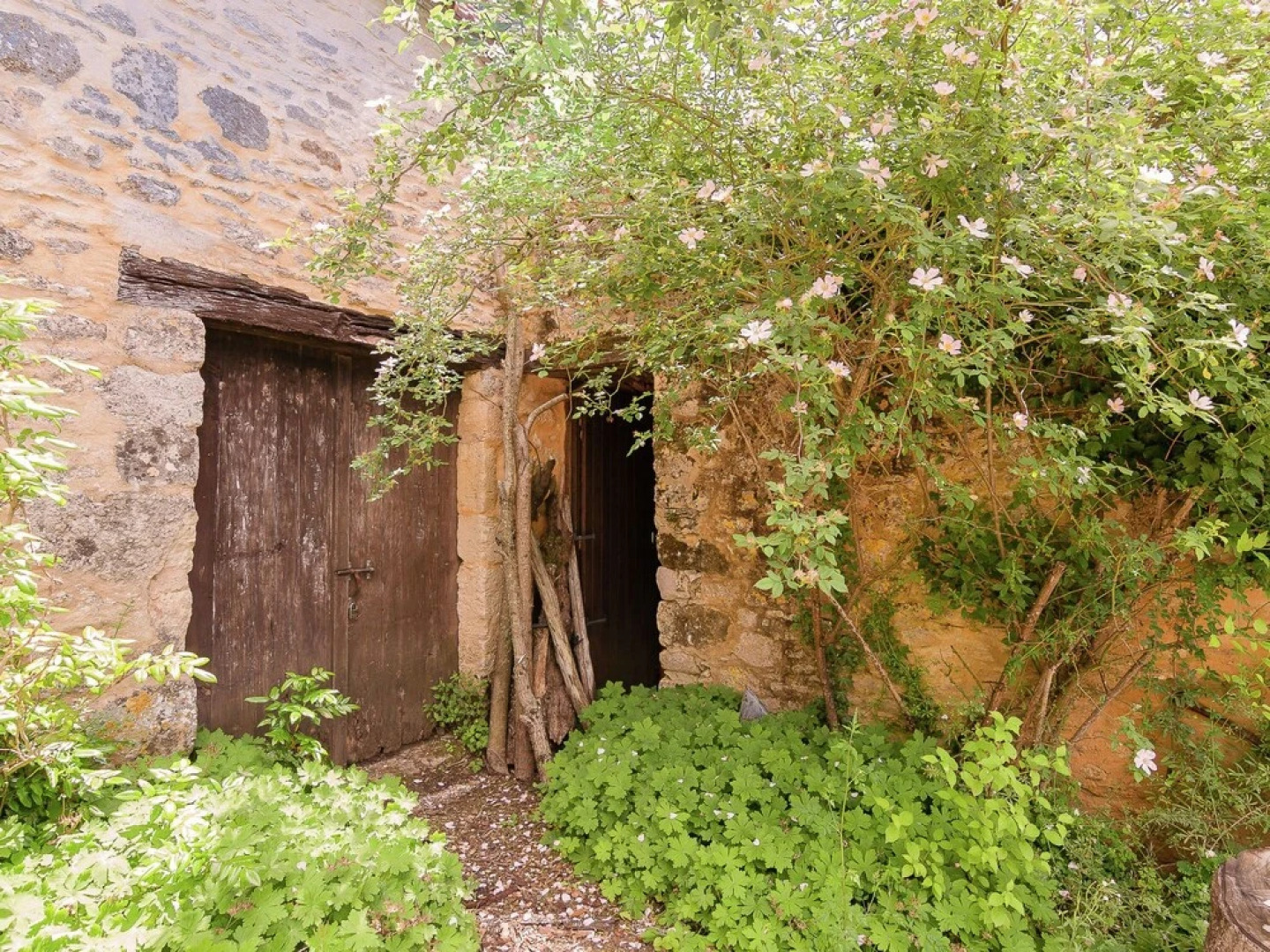 A Romantic Hamlet With Lush Gardens on a Hill