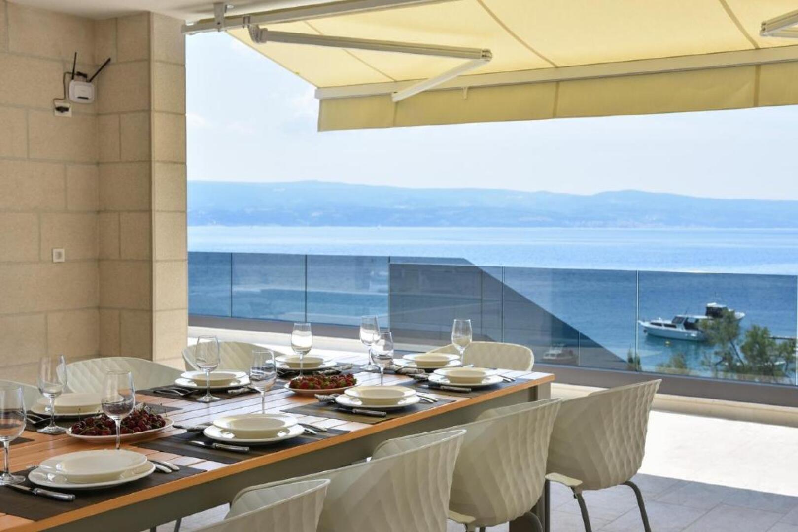 Luxury, seafront Villa Petra with heated pool only 50m from beach