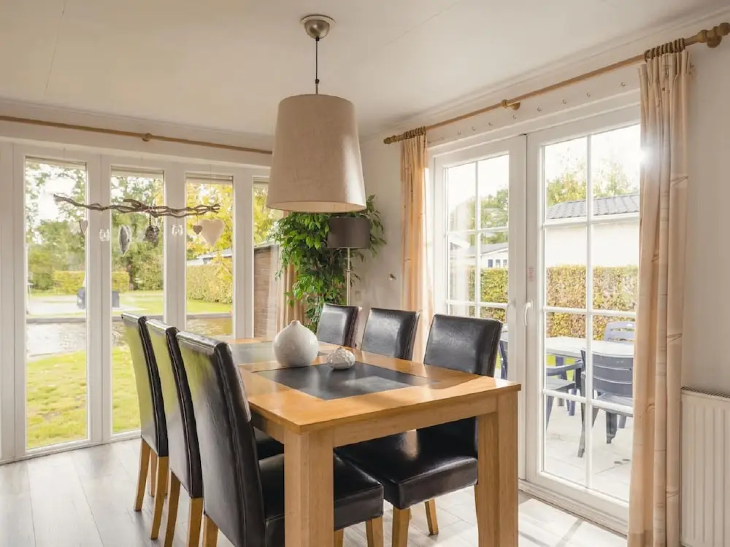 Comfy chalet with a dishwasher, directly on a pond