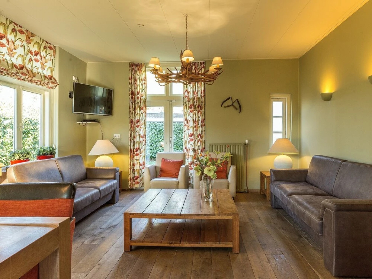 Characteristic house with a garden, surrounded by forest