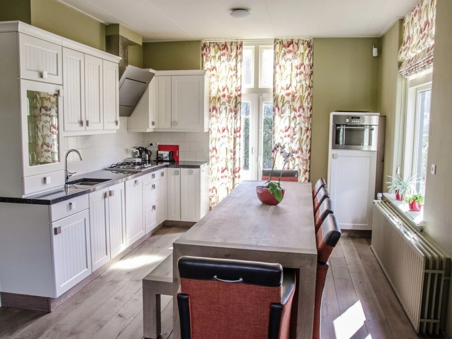 Characteristic house with a garden, surrounded by forest