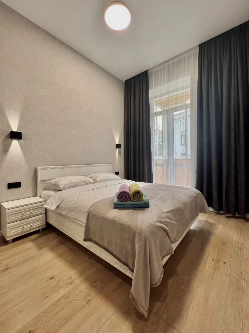 Апартаменты Светлая двухкомнатная квартирка возле ЦУМа