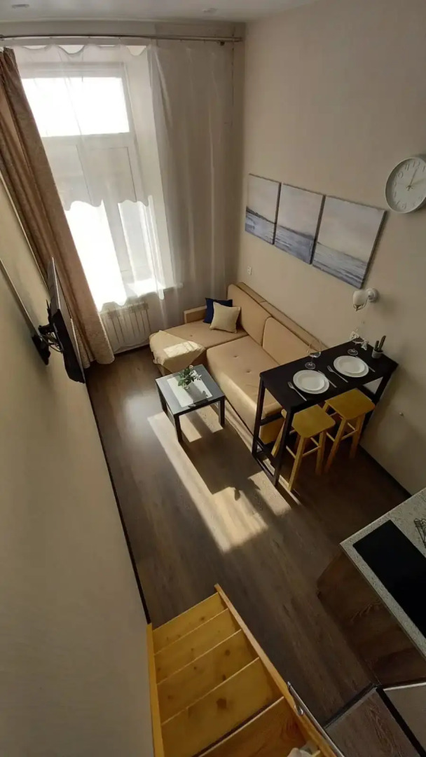 Апартаменты Уютная Двухуровневая Студия в Центре Города