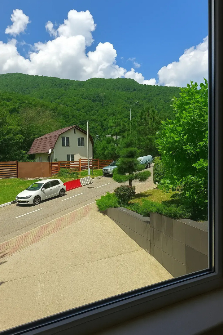 Квартира Студия с витражными окнами с видом на лес и горы