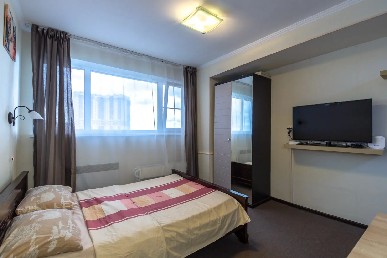 Апартаменты Истоман для Двоих с видом на город