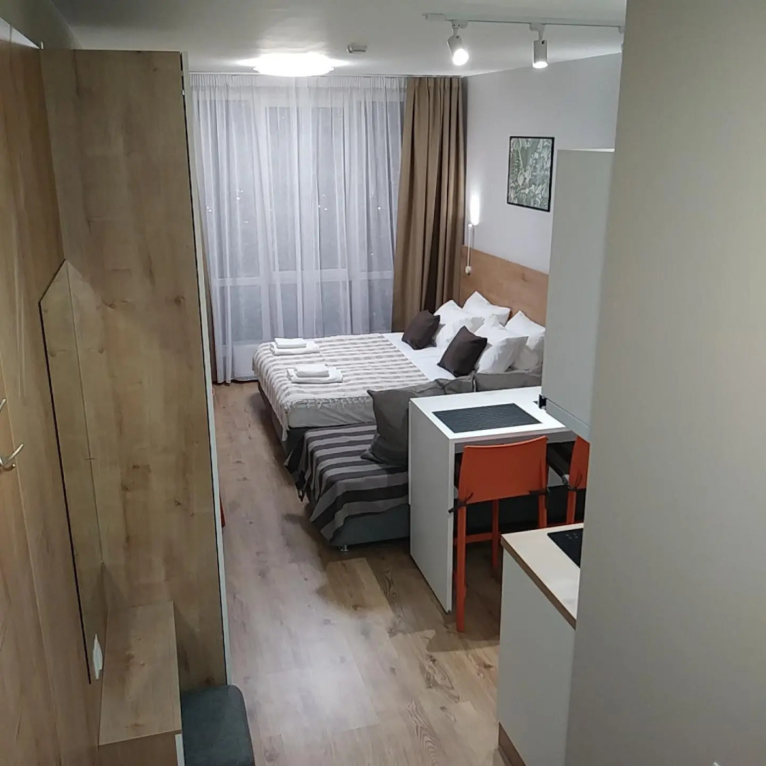 Апартаменты Уютная Студия с панорамным видом на город рядом с метро Парнас