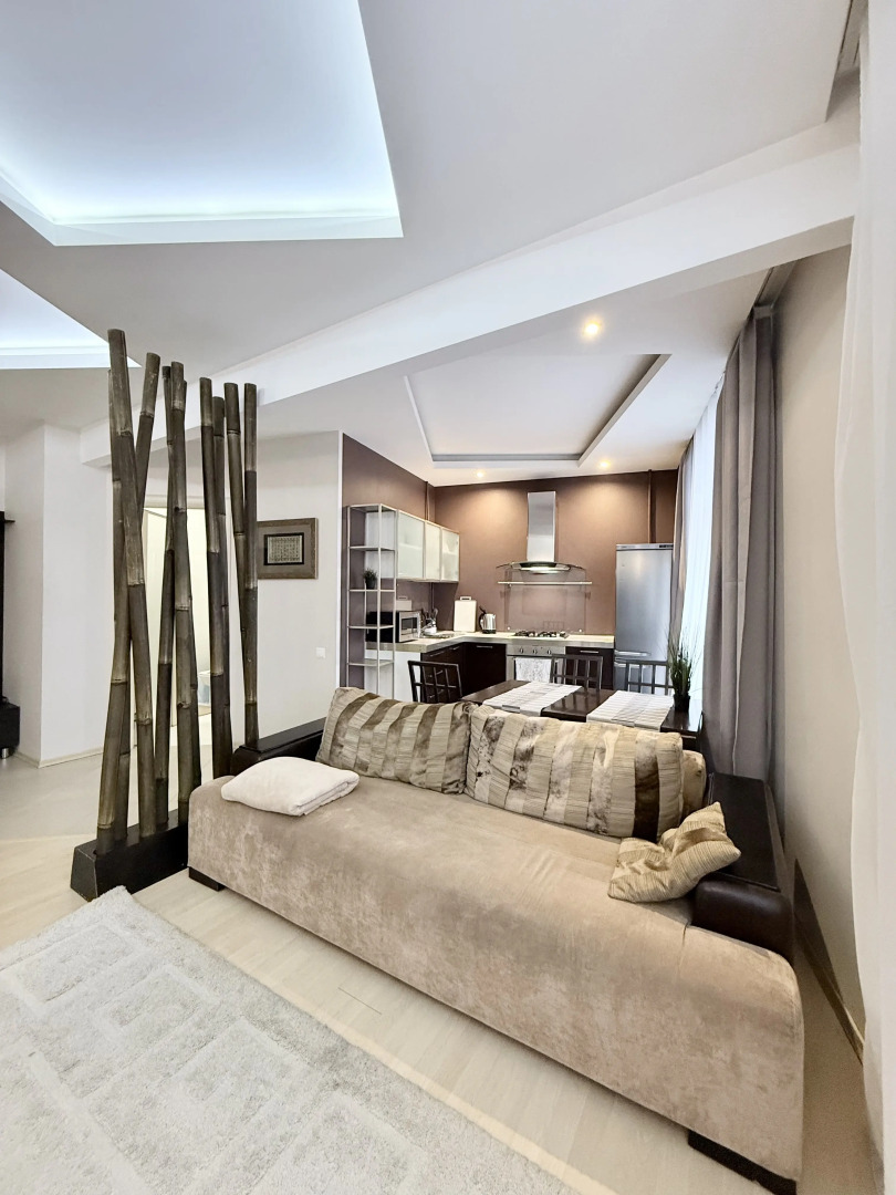 Апартаменты Уютная двухкомнатная квартира рядом с ЦУМом