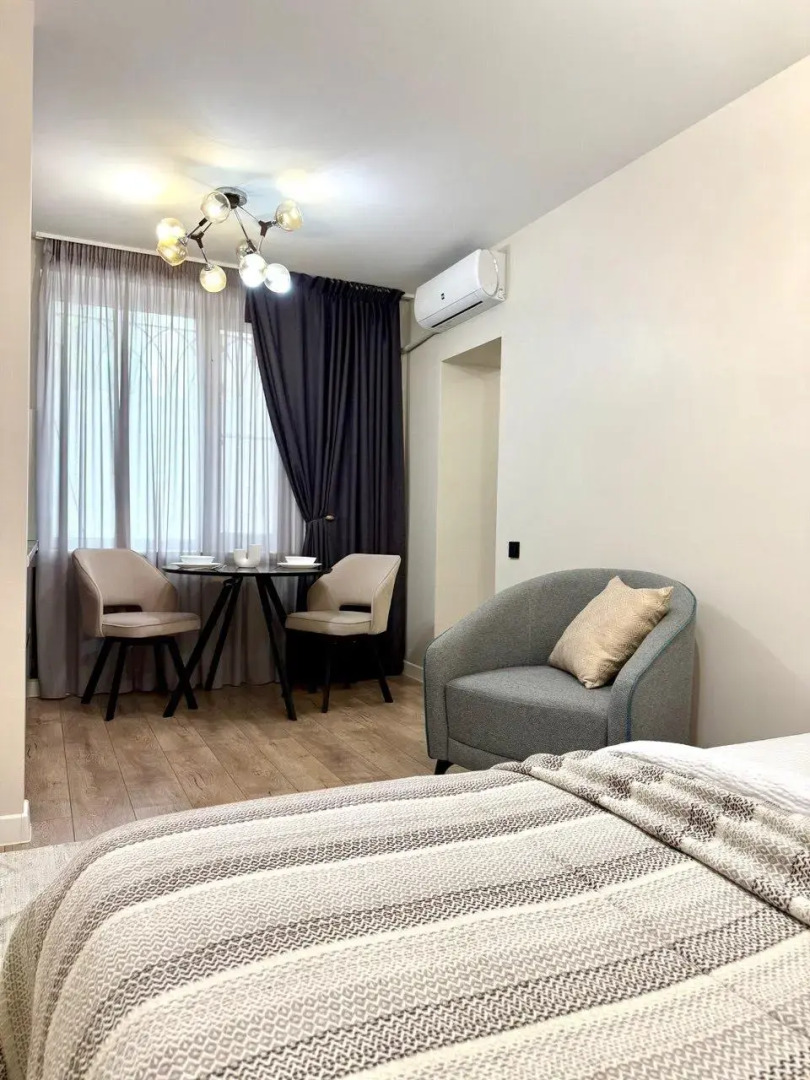 Современная студия в центре Апартаменты