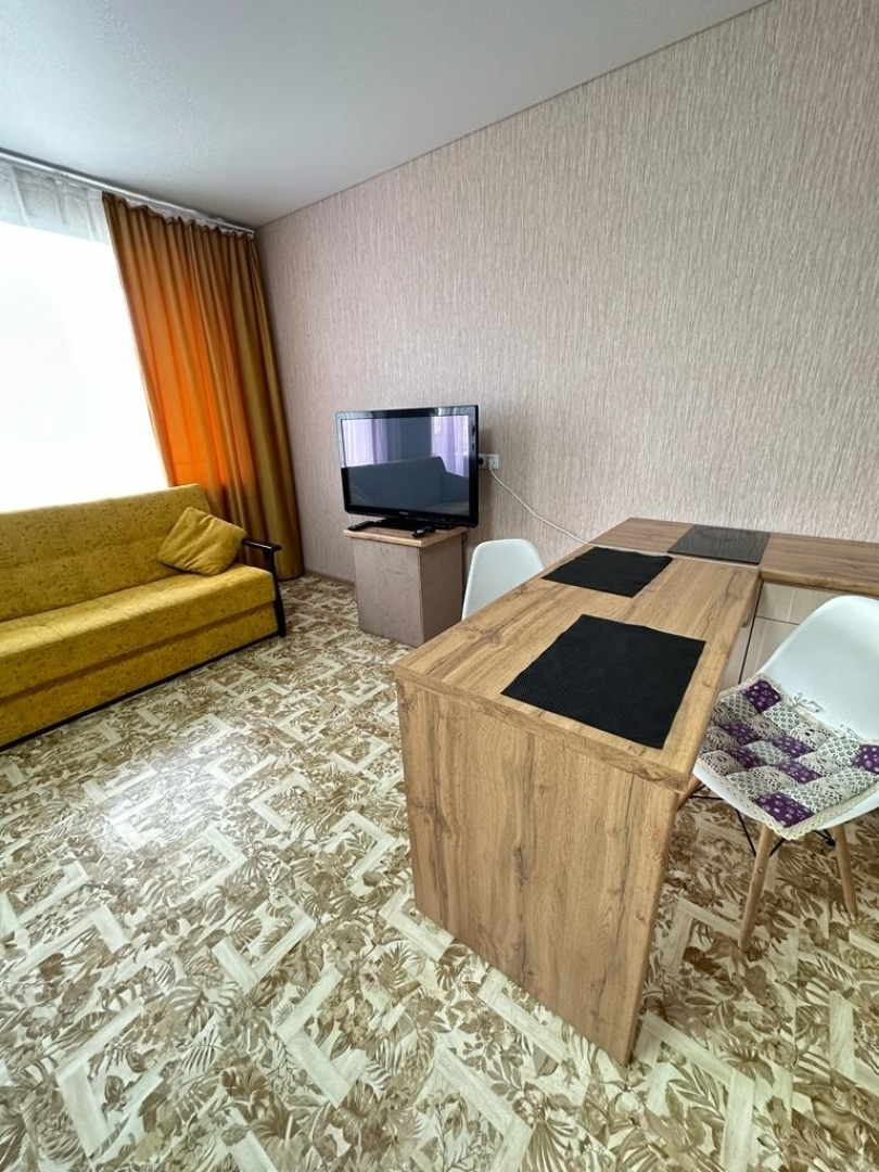 Квартира Уютная студия рядом с горoдской библиoтекой