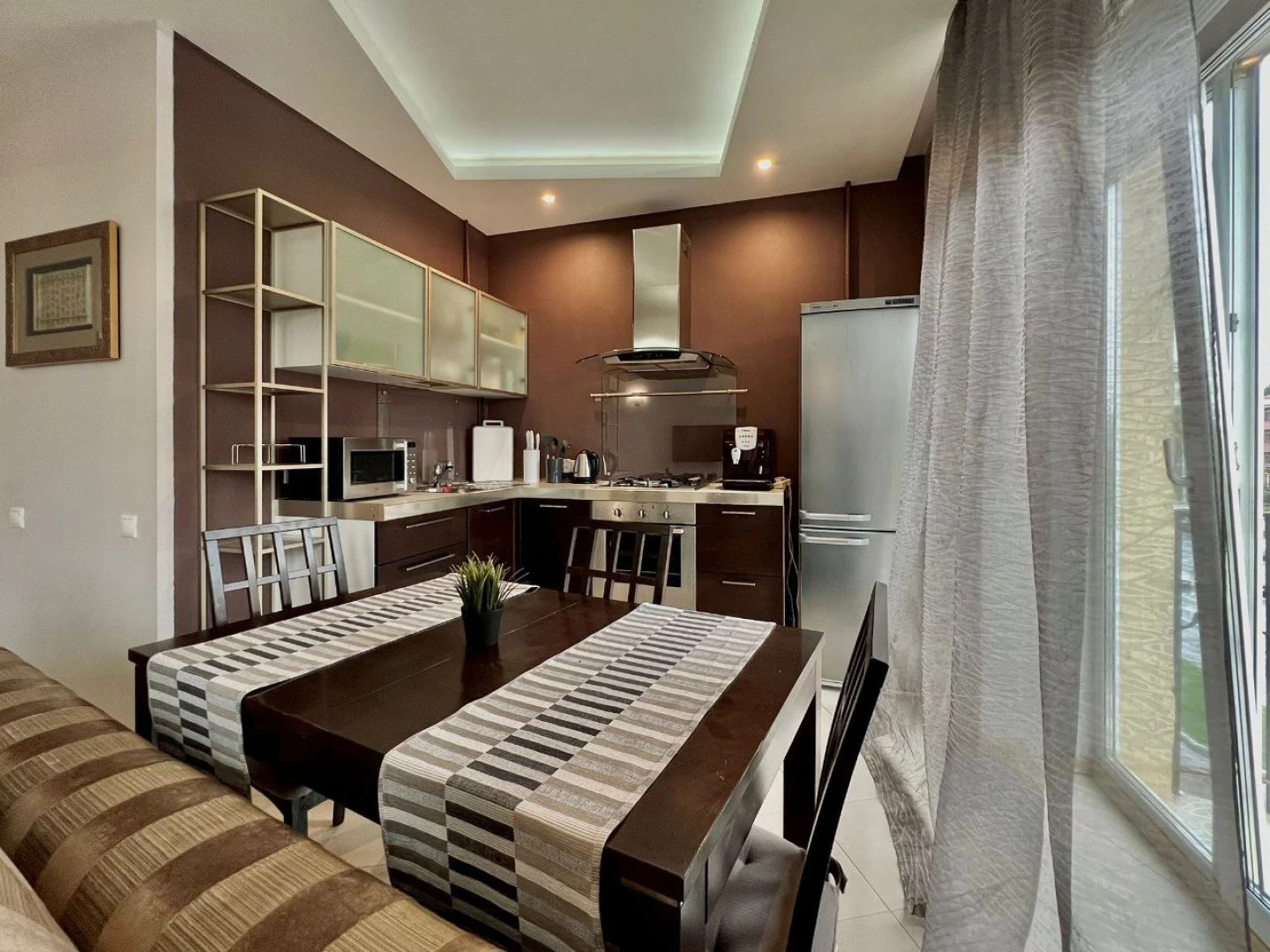 Апартаменты Уютная двухкомнатная квартира рядом с ЦУМом