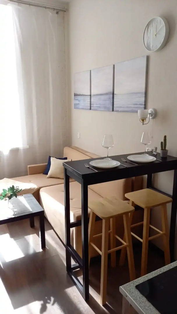 Апартаменты Уютная Двухуровневая Студия в Центре Города