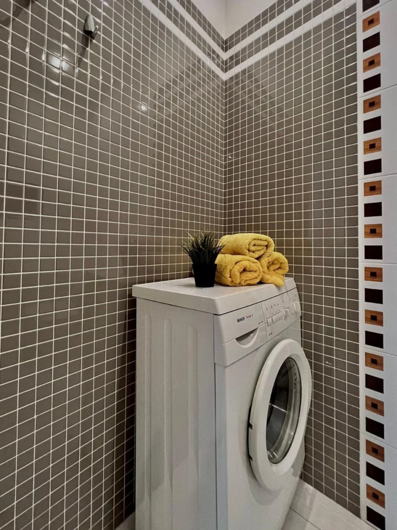 Апартаменты Уютная двухкомнатная квартира рядом с ЦУМом