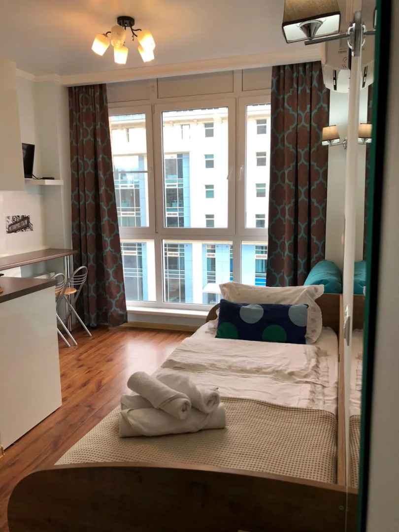 Апартаменты Маленькая студия с большим панорамным окном