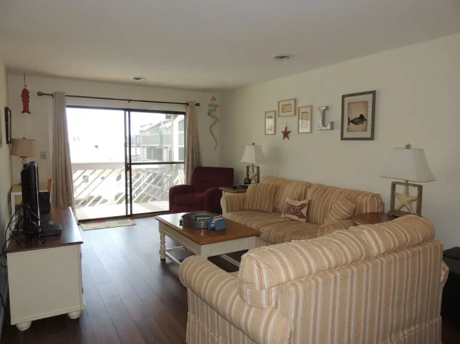 Shipwatch Pointe I #E207 2nd Row & Beyond (P) by RedAwning
