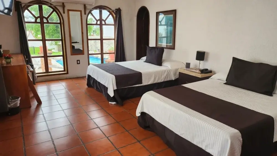 Standard Quadruple room with balcony and with pool view