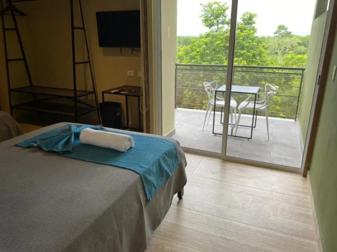 Standard Quadruple room with balcony and with garden view