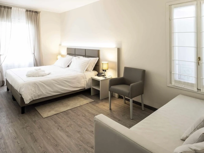 Standard Quadruple room with garden view