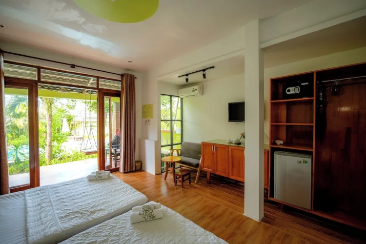 Deluxe Quadruple room with balcony and with garden view