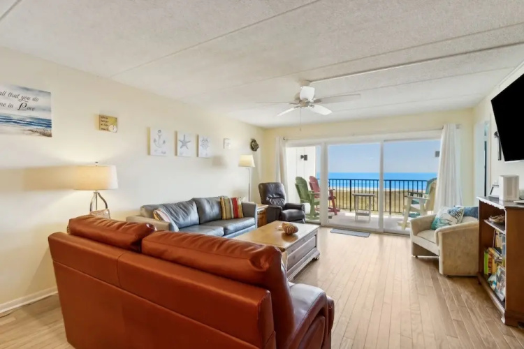 Oceanfront Beach Condo with Private Balcony, Short Walk to Pool and Beach by RedAwning