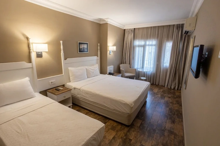 Standard Quadruple room with balcony and with garden view