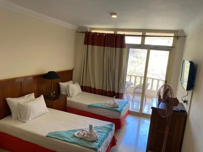 Deluxe Triple room with balcony and with garden view