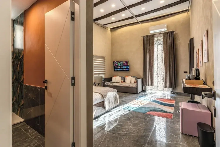 Classic Quadruple room with balcony and with city view