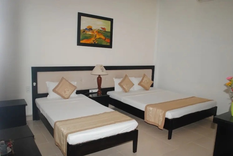 Deluxe Triple room with balcony and with garden view