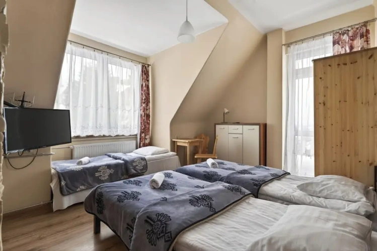 Standard Triple room with balcony and with garden view