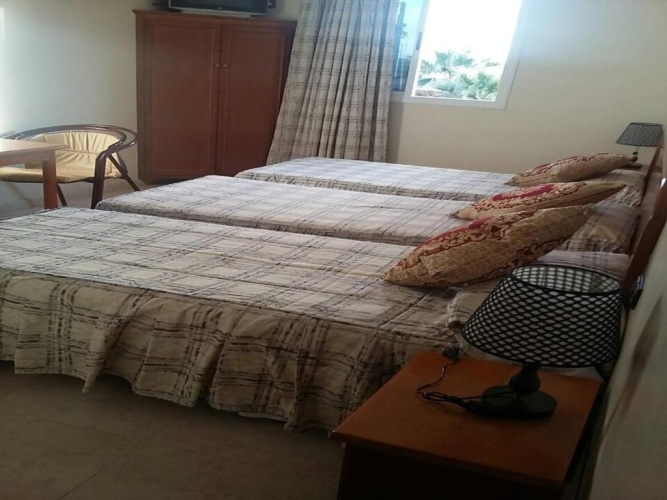 Standard Triple room with garden view